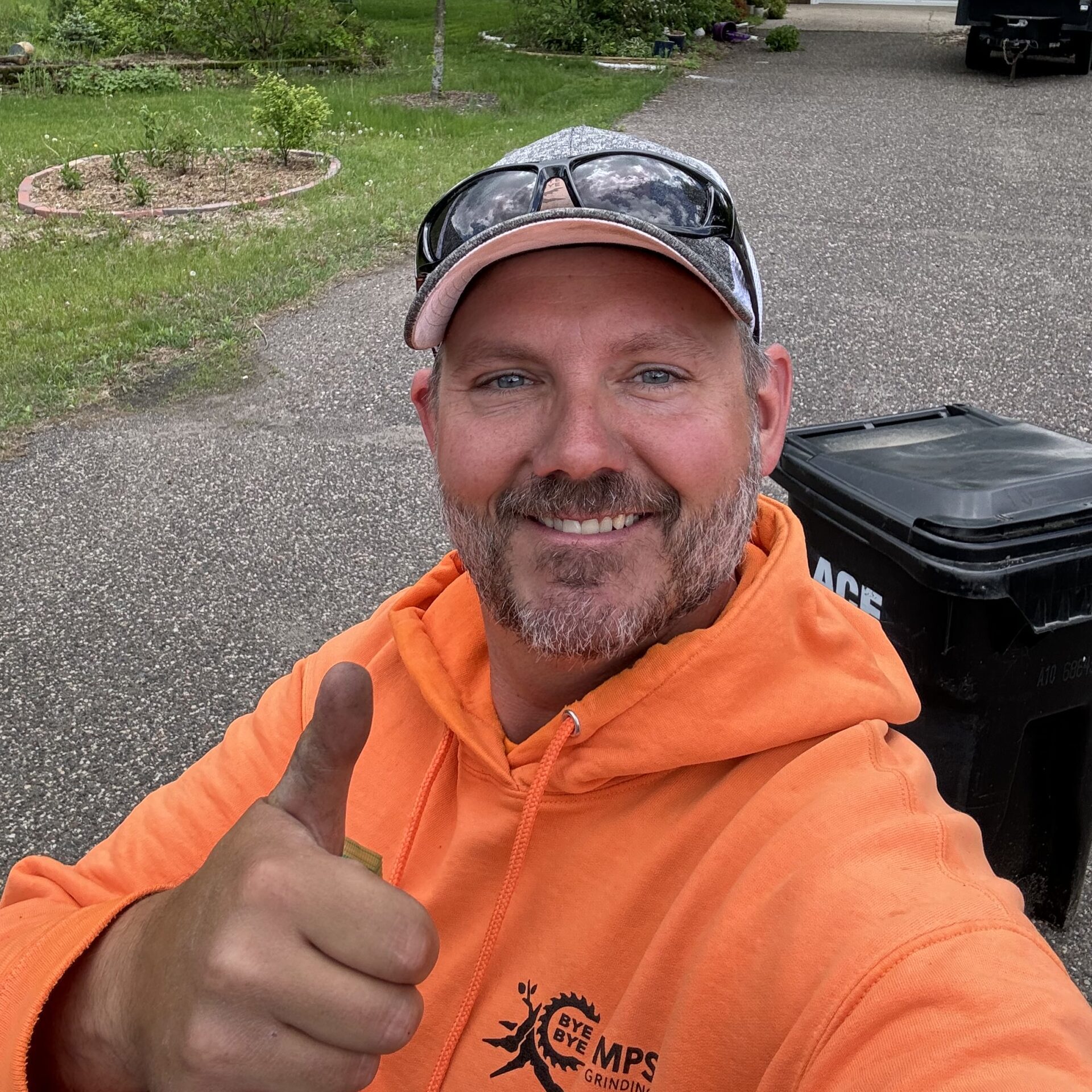 man giving a thumbs up - stump grinding equipment